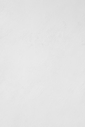 a man riding a snowboard down a snow covered slope