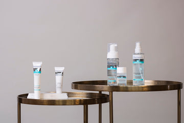white and blue plastic bottles on table