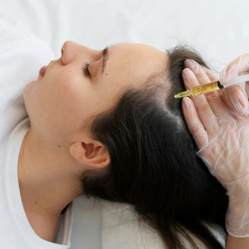 Woman receives a hair treatment injection