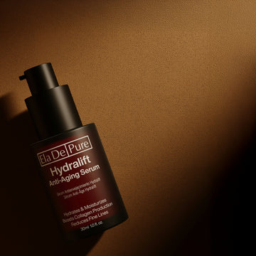 Hydralift anti-aging serum is shown on a dark background.