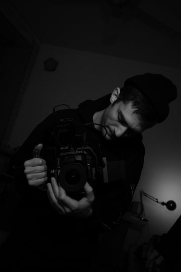 Man holding a professional video camera rig