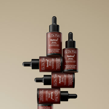 Several bottles of dr. dennis gross retinol serum stacked.