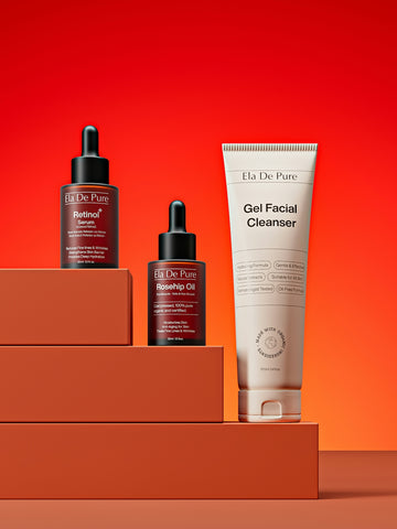 Skincare products arranged on orange steps against red background