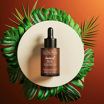 Retinol serum bottle surrounded by tropical leaves